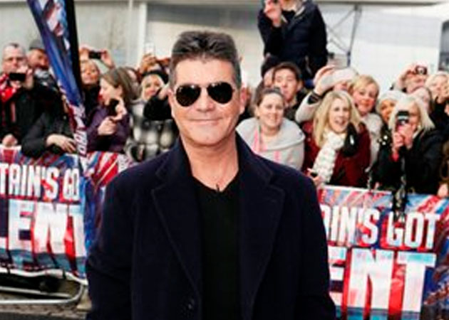 Simon Cowell calls unborn baby Tad