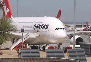 Qantas says strikes, fuel costs to hit half year earnings