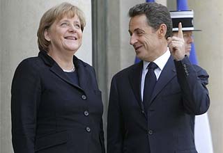 Sarkozy, Merkel press debt plan with EU allies