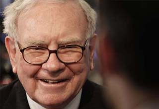 Buffett delivers news and a tune at US press club show