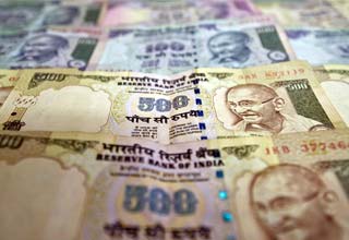 Rupee slips to day's low of 55.81/$ after S&P warning