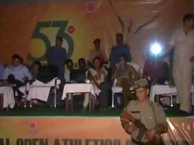 Athletes receive medals in darkness due to power failure