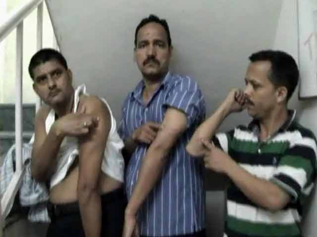 Video : Senior cop suspended for beating staff for making Samajwadi leader wait