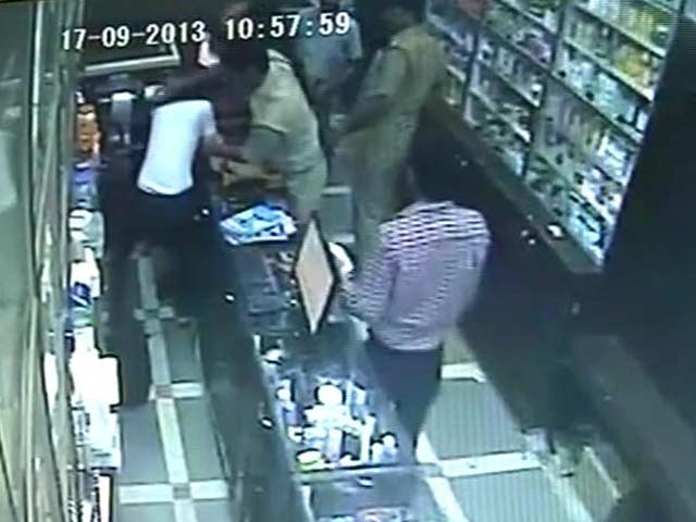 Video : Caught on camera: rogue police guards beat up Delhi chemist
