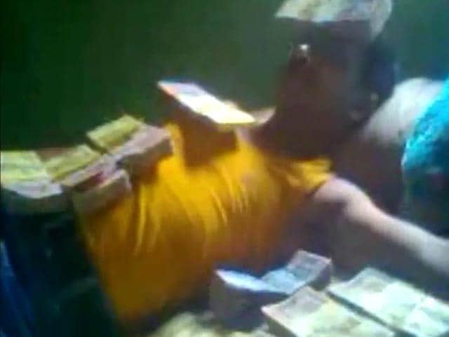 Video : Tripura CPM leader, seen lying on 'a bed of cash', expelled from party