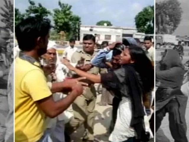 Video : Uttar Pradesh policemen suspended for beating up woman