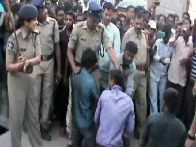 Video : Andhra cops thrash murder accused in public to 'set an example'