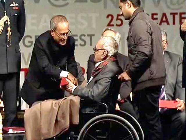 S H Raza receives his award from the President