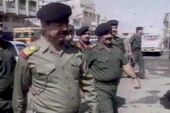 The World This Week: Saddam Hussain pulls back troops from Kuwait border (Aired: October 1994) The World This Week: Saddam Hussain pulls back troops from Kuwait border (Aired: October 1994)