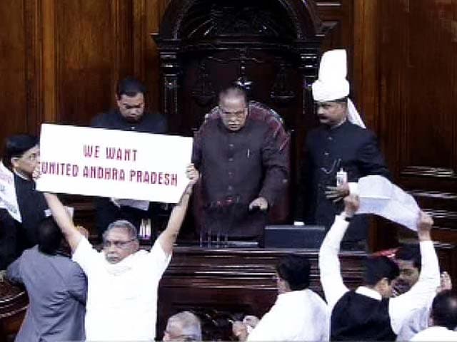 Video : MPs turn vandals in Rajya Sabha. Papers torn, chairman's mic broken