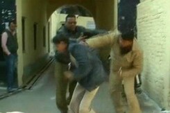 Caught on camera: UP cops thrash mentally-challenged man Caught on camera: UP cops thrash mentally-challenged man