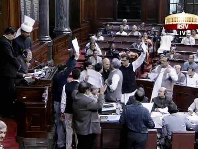 Video : Amid chaos and slogans, Rajya Sabha clears Telangana Bill