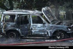 AAP Candidate's Car Set on Fire as Supporters Clash With BJP Workers AAP Candidate's Car Set on Fire as Supporters Clash With BJP Workers
