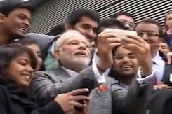 PM Narendra Modi Clicks Selfie With Indian Students in France PM Narendra Modi Clicks Selfie With Indian Students in France