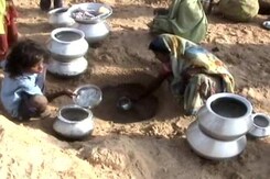 Heat Wave Drives Villagers to Dig Into River Bed Heat Wave Drives Villagers to Dig Into River Bed