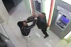 Man Beats "Robber" at an ATM Machine in China Man Beats "Robber" at an ATM Machine in China