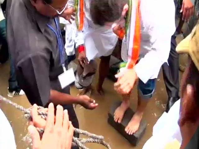 Video : Former Minister Holds Slippers for Rahul Gandhi in Flooded Puducherry