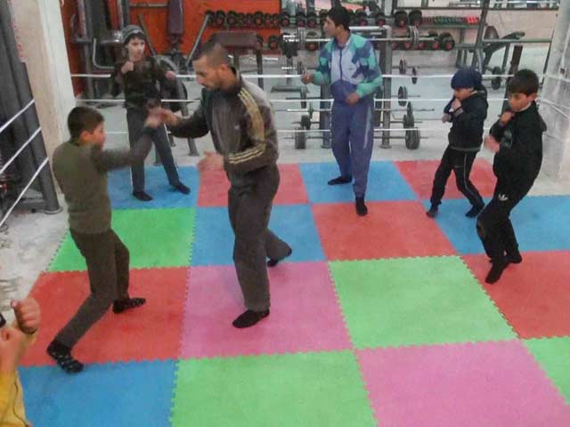 In Syria's Aleppo City, Young Boys Box to Drown Out Bombs