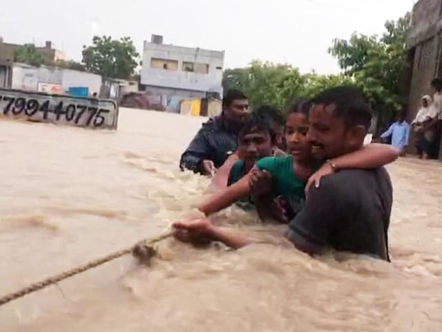 Ropes Used To Rescue People From Flooded Homes In Andhra's Guntur
