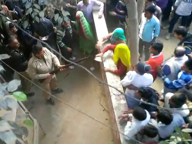 In Video Outside Western UP Bank, Cop Fires In Air, Takes Aim At Those Assaulting Him
