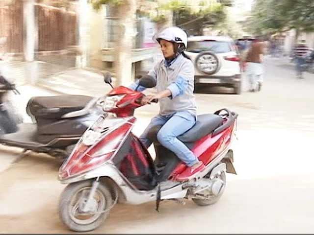 girl riding scooty