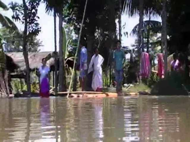 With Husband's Broken Spine, Assam Floods Restrict Couple To A Banana Plant Raft