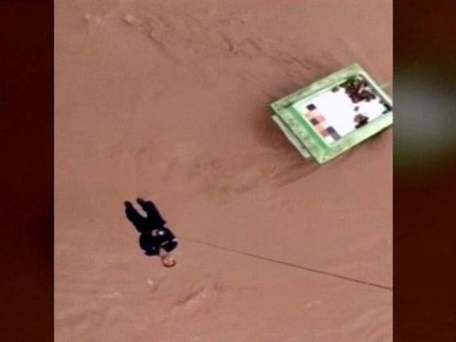Watch: Dangling From Chopper, Rescuer Helps Flood Victims In Gujarat
