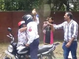 Video : Delhi Cop Caught On Camera Attacking Woman With Brick